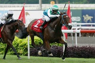 Infantry (NZ) claims the Singapore Derby at Kranji. Photo: Singapore Turf Club